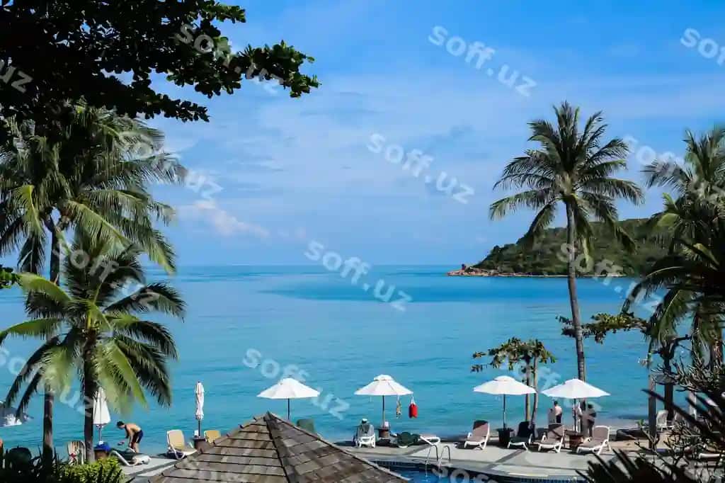 Manzilatli peshqon ko'k osmon orqali | Scenic view beach against blue sky